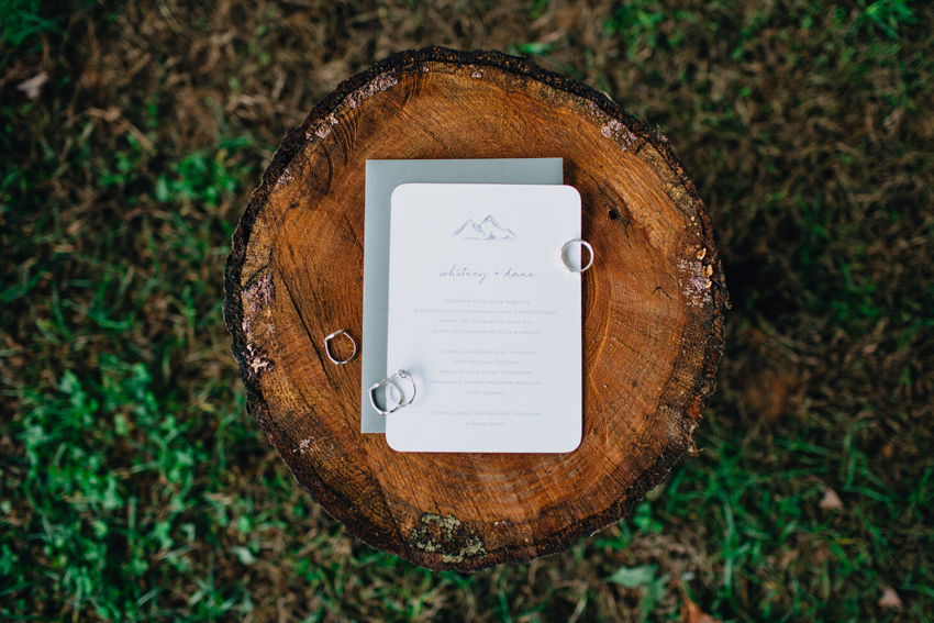 Rustic mountain wedding invitations on a tree stump for Splendor Mountain