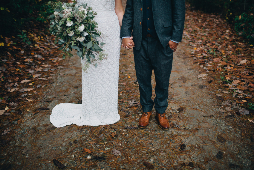 bride & groom holding hands in the Georgia mountains