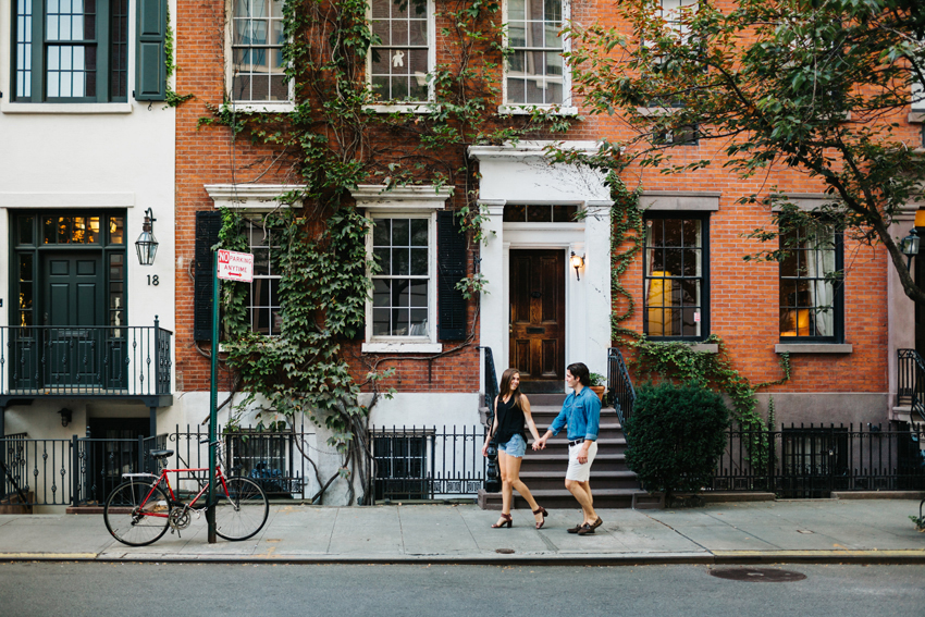 Engagement photo of a couple walking the streets of the west village in manhattan