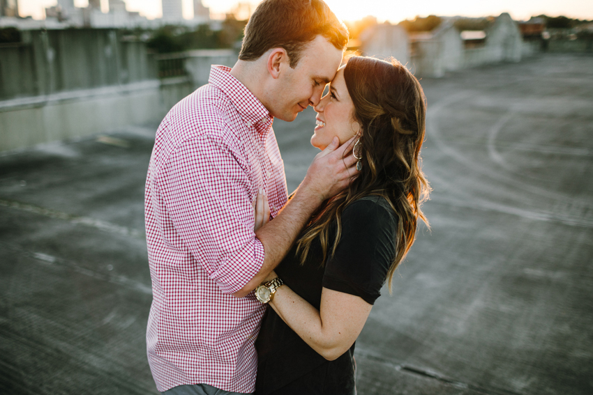 Golden romantic engagement session at sunset on a rooftop in Ybor City Tampa