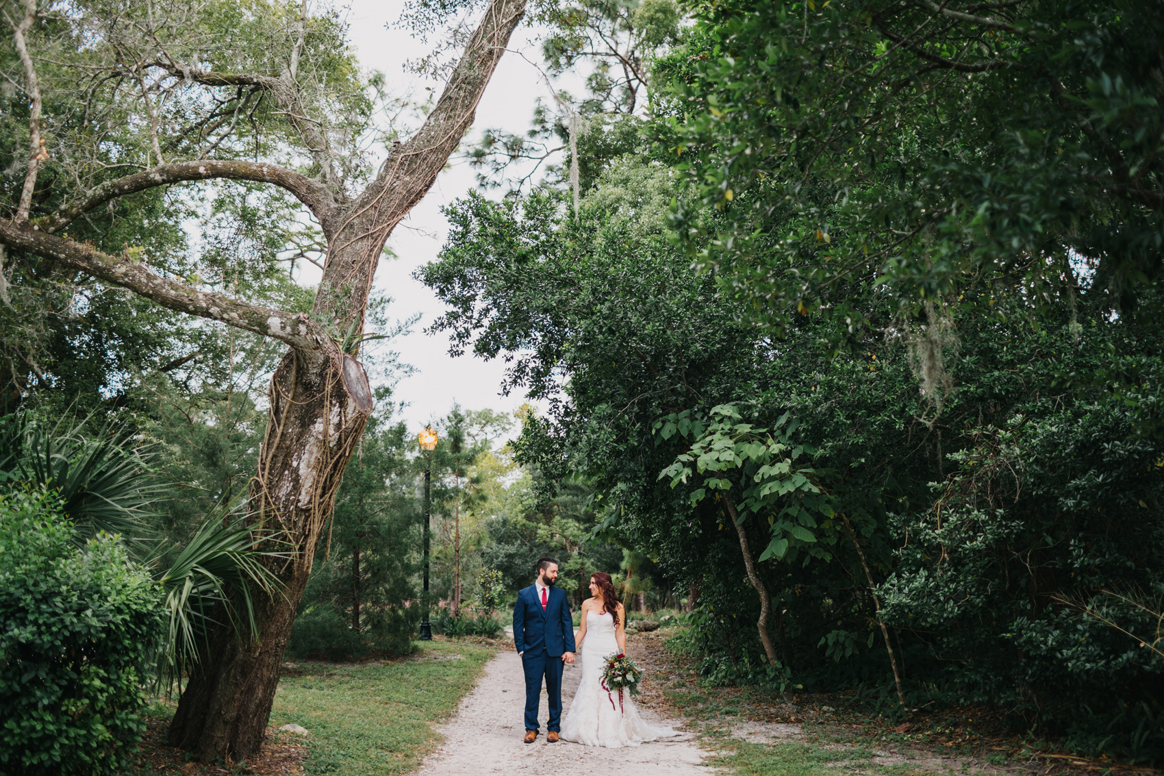 Woodsy natural wedding photos of the bride and groom at Mead Garden in Orlando