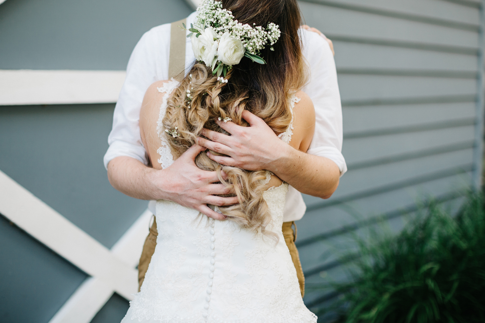 bride with baby breath and fresh flowers in her hair