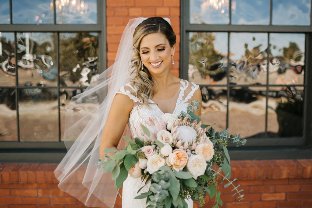 gorgeous bride outside of Armature Works wedding with hair and makeup done by lasting luxe