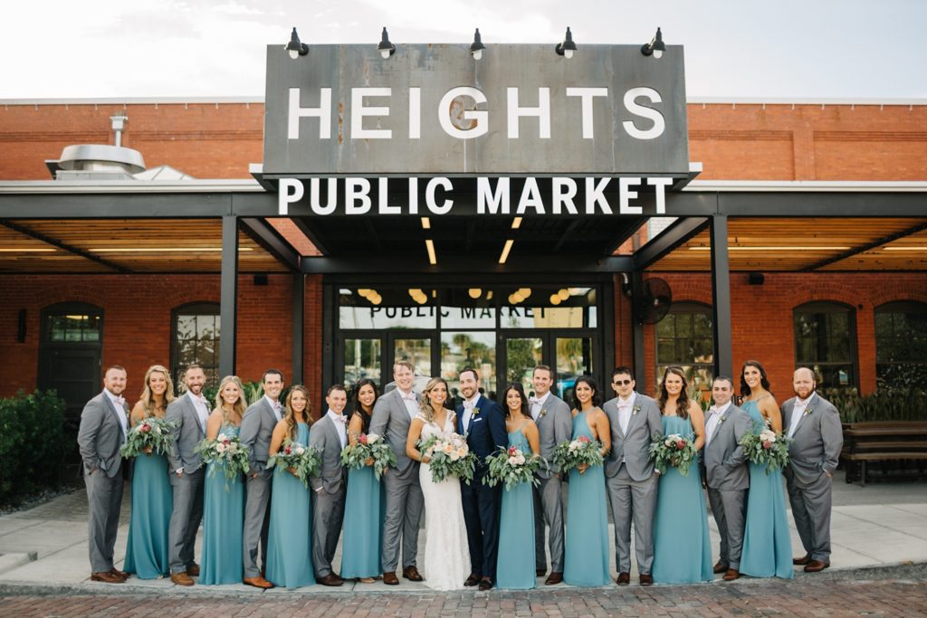 Bridal Party standing in front of Heights Public Market sign