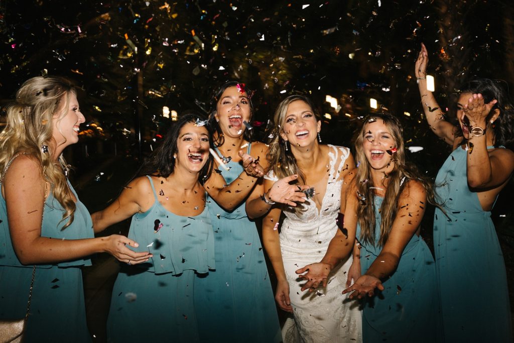 bridesmaids throwing confetti at the end of the knight