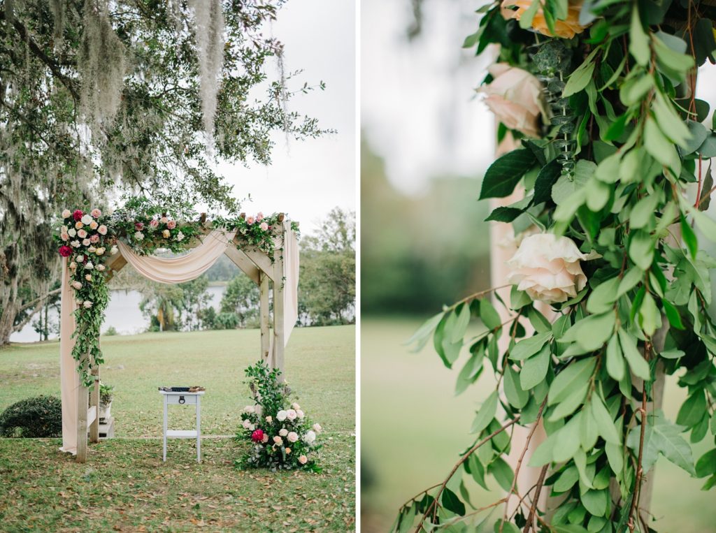 floral covered wedding arch with draping and lush peach and pink ranunculus and garden roses