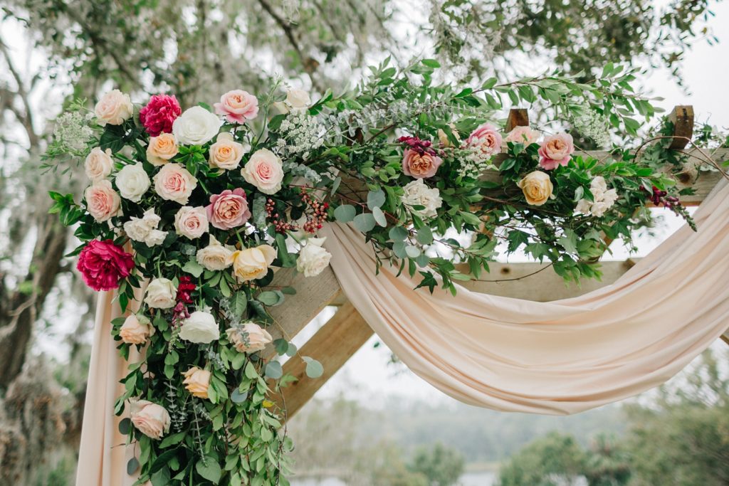 lush blooms covering the wedding arch
