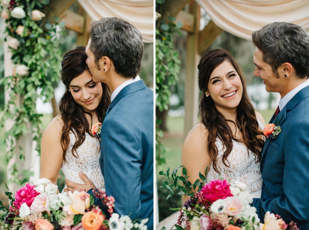 romantic newlywed photos under the floral ceremony arch