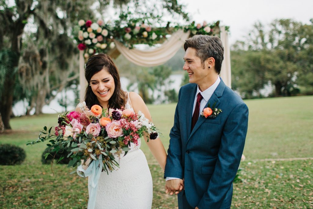 Orlando wedding photos with natural light and a floral backdrop at historic Sydonie Mansion