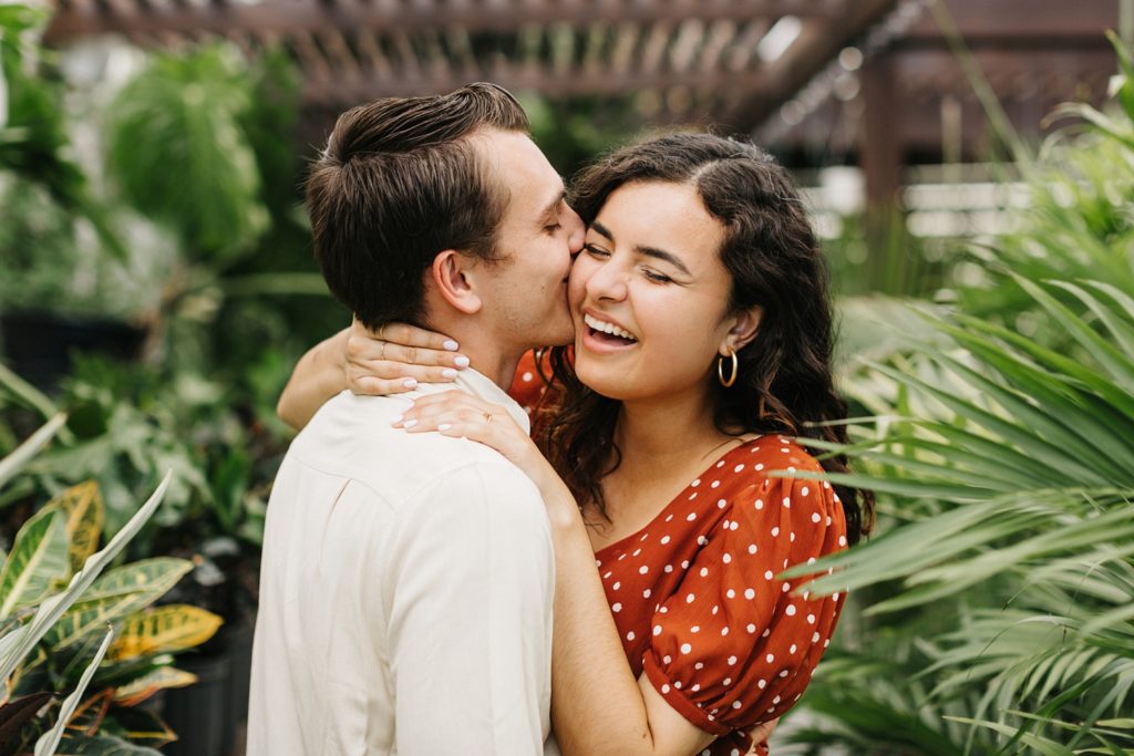 candid engagement photos in downtown tampa plant shop