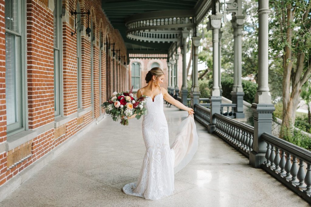 Bride twirling in a fitted wedding dress by miss hayley paige before industrial wedding at armature works