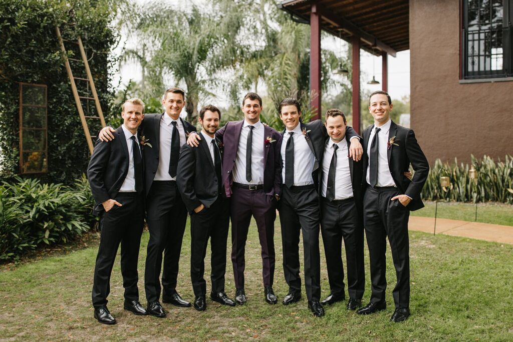 Groomsmen hanging out before the outdoor ceremony in Orlando