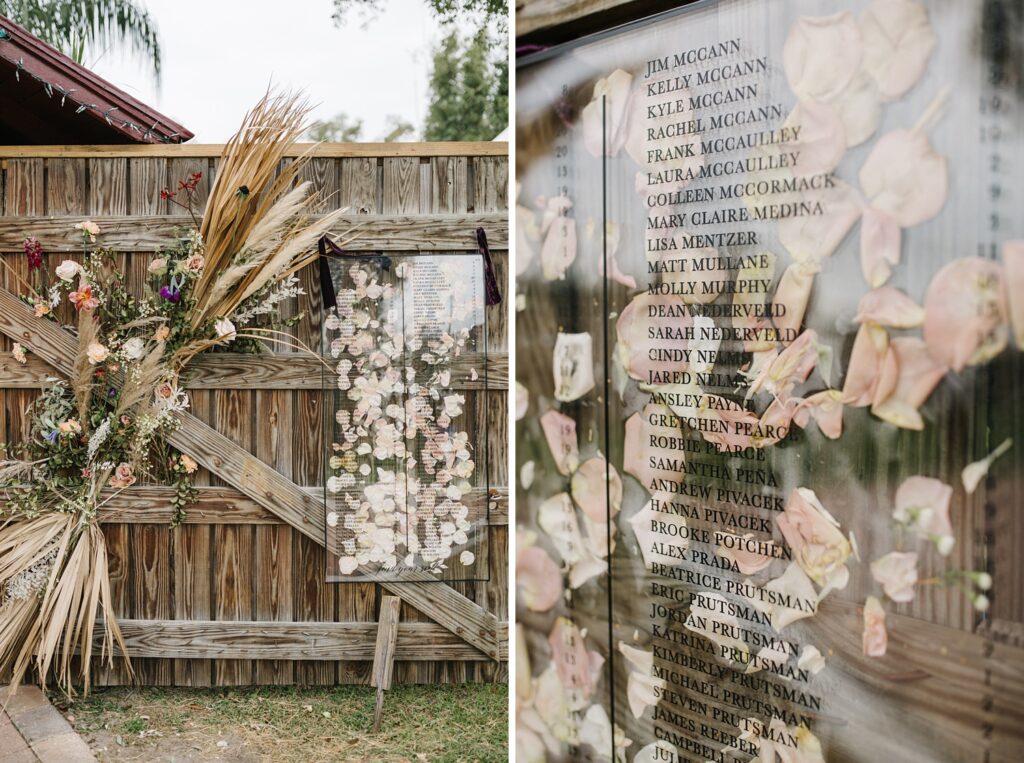 oversized acrylic wedding seating chart with pampas grass and floral accents