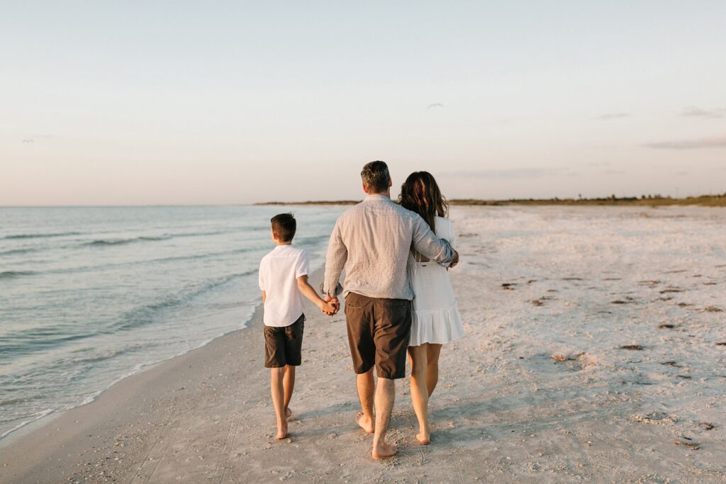 candid family photos on the beach at sunset in St. Pete Florida