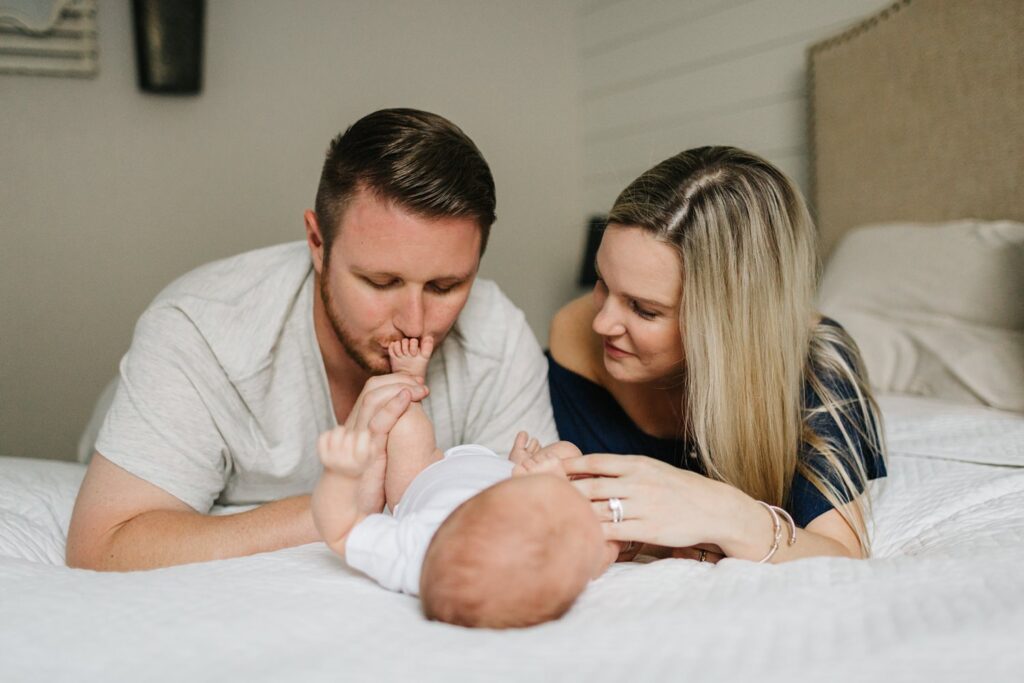 dad kissing baby during newborn session