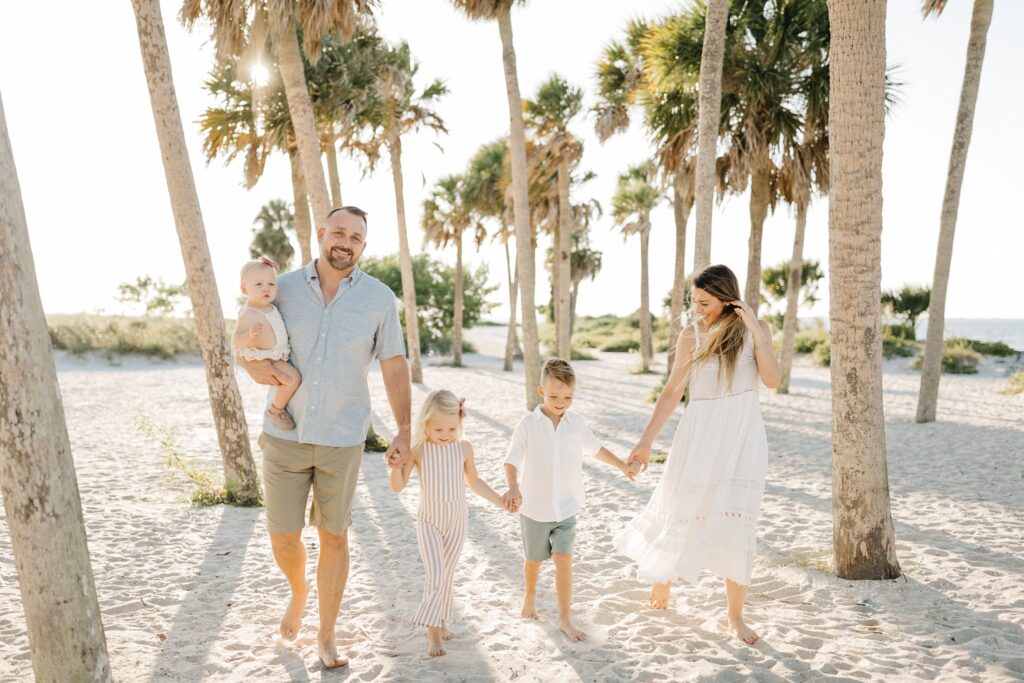 Family photos with palm trees on Fred Howard Beach