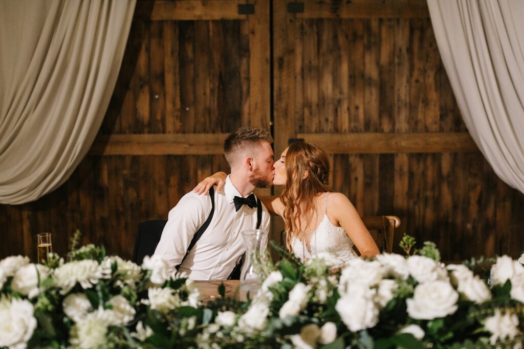 bride and groom kissing at the reception