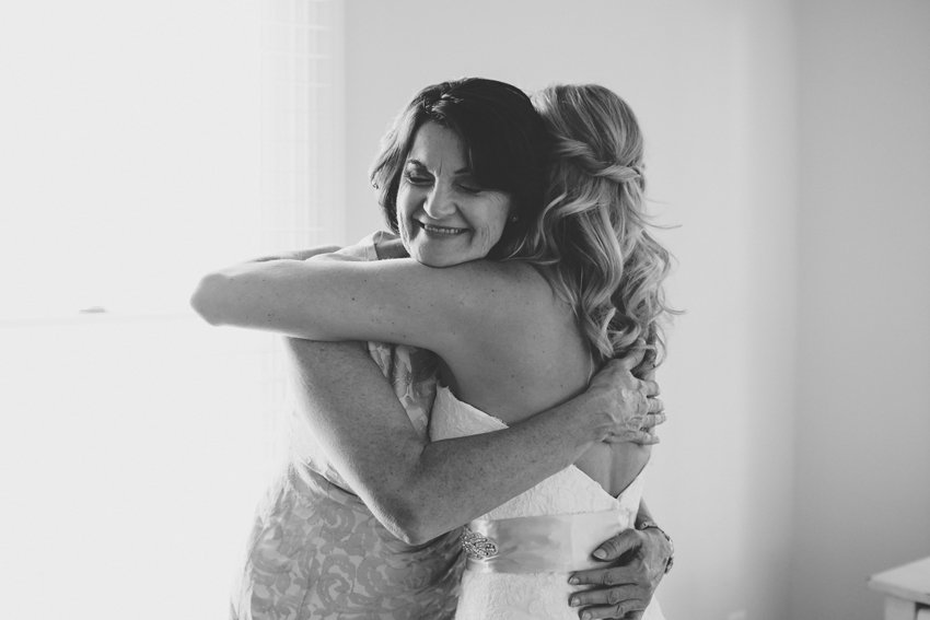Bride and Mother of the Bride hugging