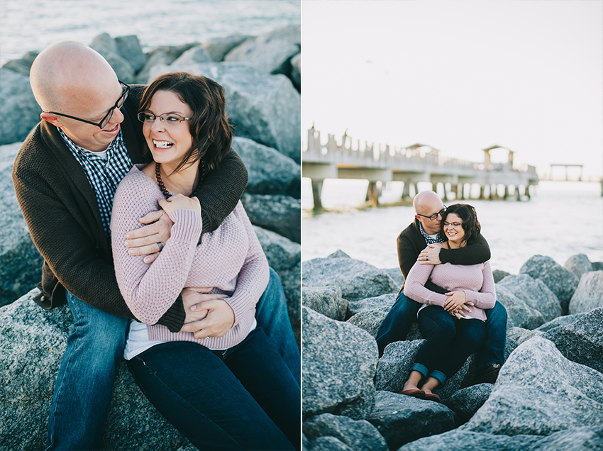 Engagement session on the rocks on St. Pete Beach at sunset