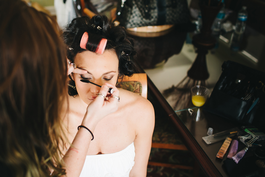 Bride putting on makeup before her romantic garden wedding in Sarasota