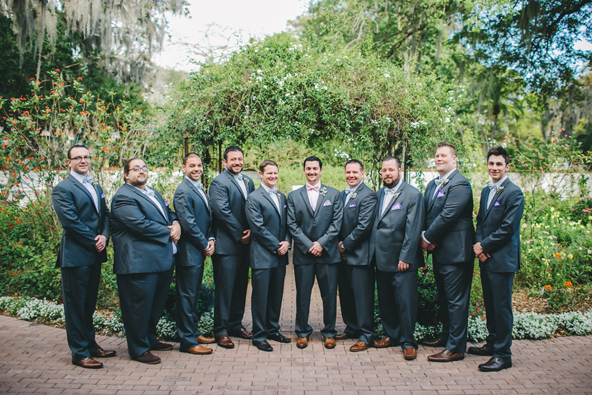 Groomsmen in front of the gardens at Marie Selby Gardens