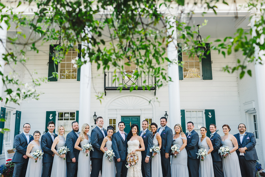 Wedding party in front of the white mansion at Marie Selby Gardens