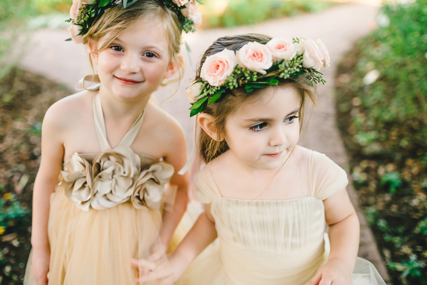 Cute flower girls in tulle dresses and flower crowns
