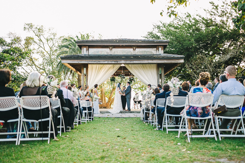 Romantic garden wedding ceremony under the pavilion at Marie Selby Gardens