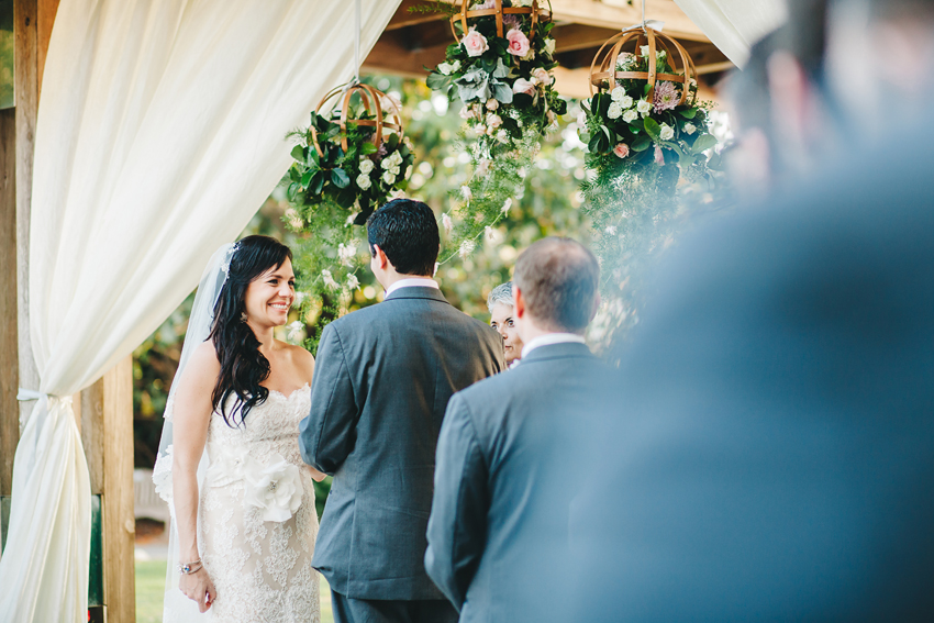 Happy bride during wedding ceremony at the gorgeous gardens in Sarasota, Florida