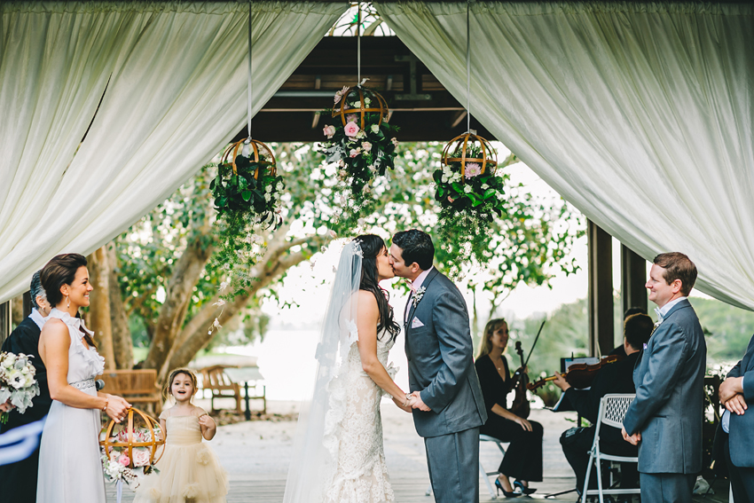 Romantic first kiss in the gardens at the beautiful Marie Selby Gardens wedding venue in Sarasota