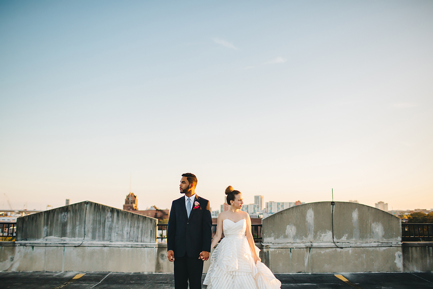Bride and groom on rooftop at sunset for modern Tampa wedding