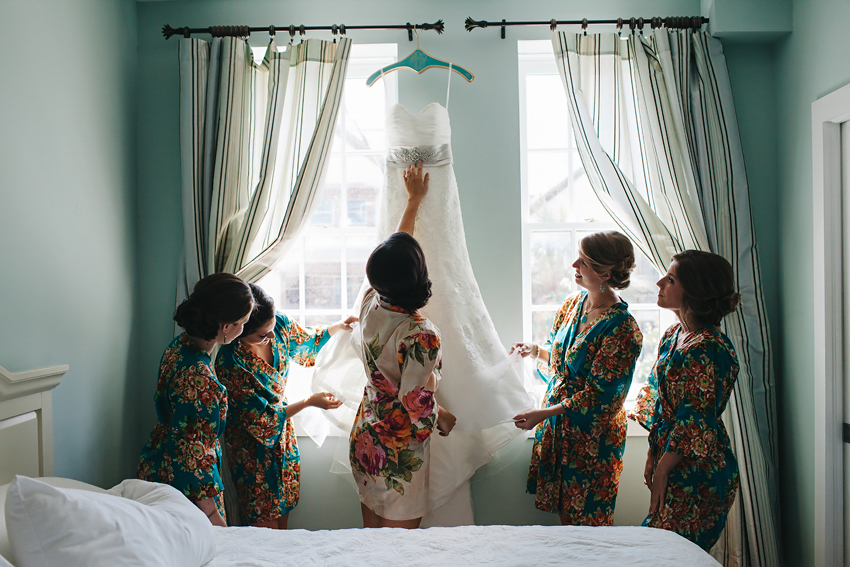 bride and her bridesmaid wearing pretty silk floral robes before the wedding ceremony in St. Augusting