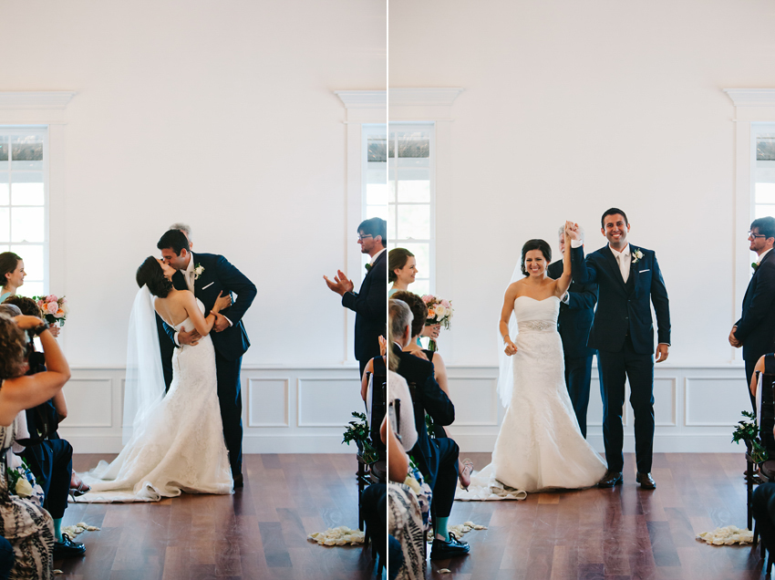 The bride & groom's first kiss at their wedding in The White Room
