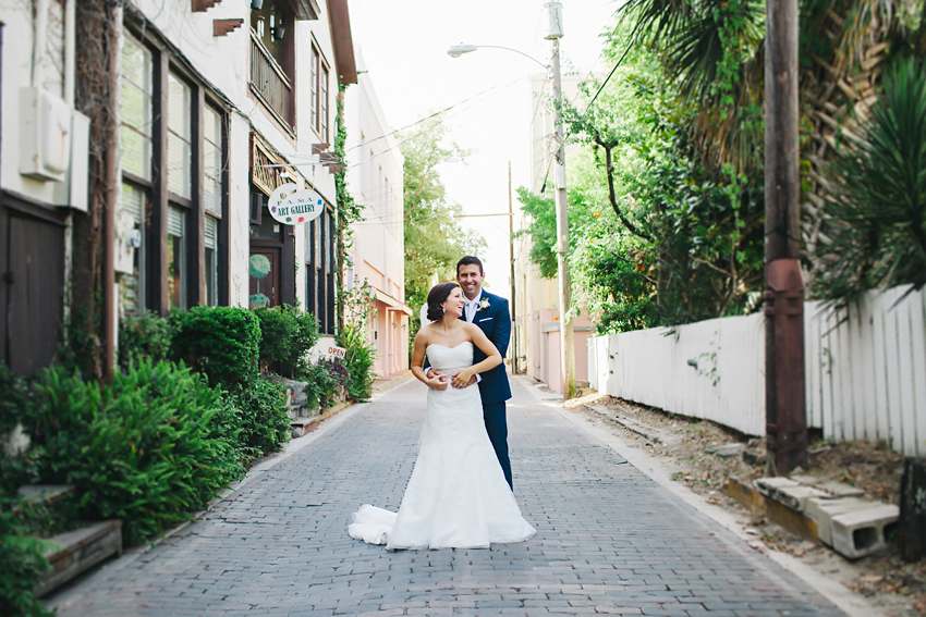Romantic bride & groom portraits in the historic streets of St. Augustine behind The White Room