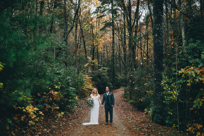 Rustic fall mountain wedding photography in the beautiful leaf covered pathway