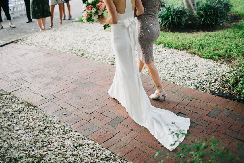 bride walking down the aisle with her mom