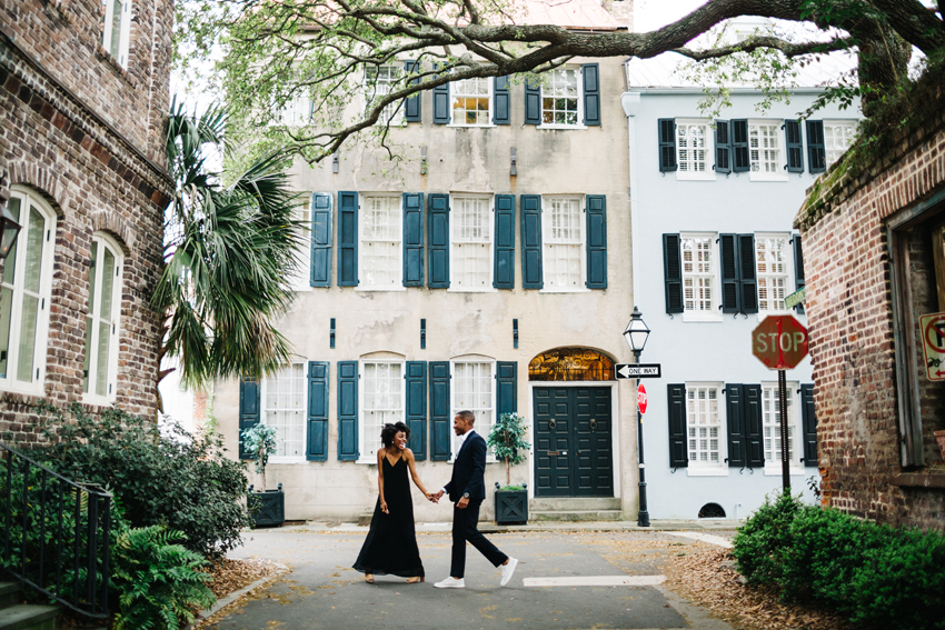 couple walking along the streets in downtown charleston