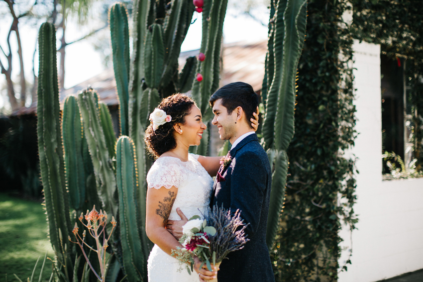 Natural, romantic wedding photography outside in front of the cactus at The Acre Orlando wedding venue