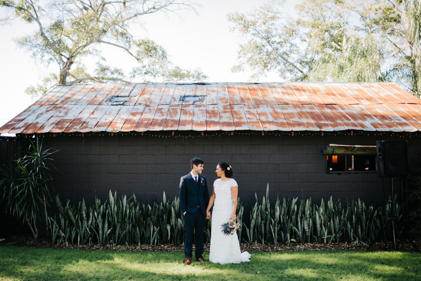 Natural wedding photography in front of the historic barn at The Acre orlando