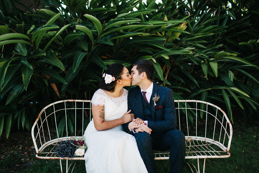 Sweet and romantic wedding photos in front of the beautiful greenery at The Acre in Florida