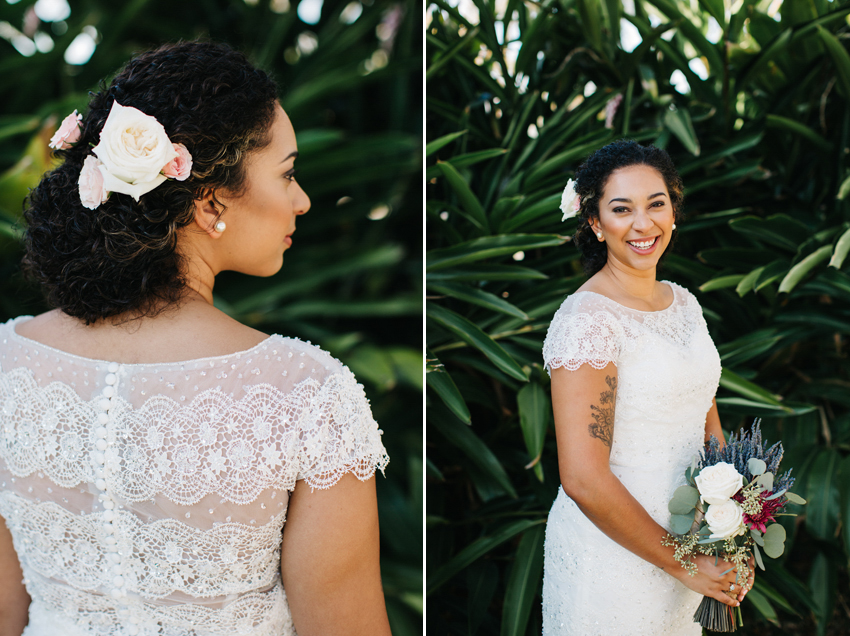 Romantic bride wearing a beaded wedding dress and flowers in her hair for her creative, outdoor wedding at the Acre