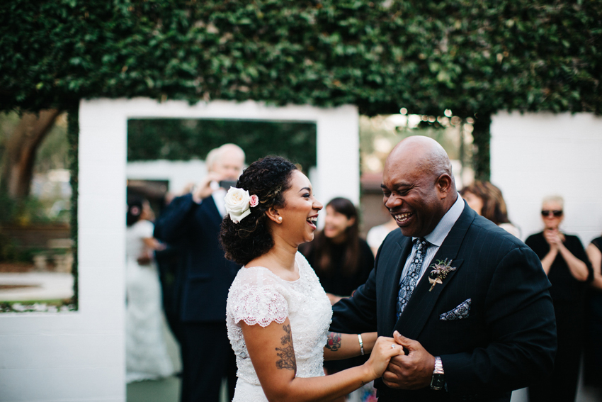 bride and her dad laughing during their dance
