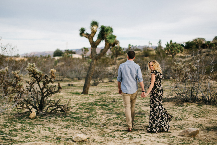 Romantic, lifestyle engagement session photos in the Joshua Tree desert at sunset