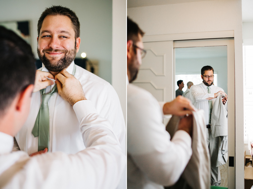 Groom getting ready in a suite at the Postcard Inn