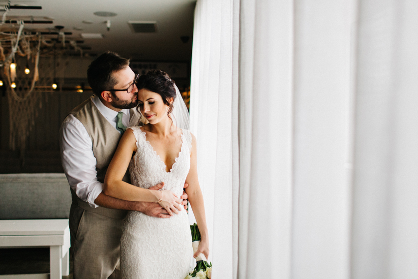 Natural and candid wedding photography in the lobby at The Postcard Inn in St. Pete Florida