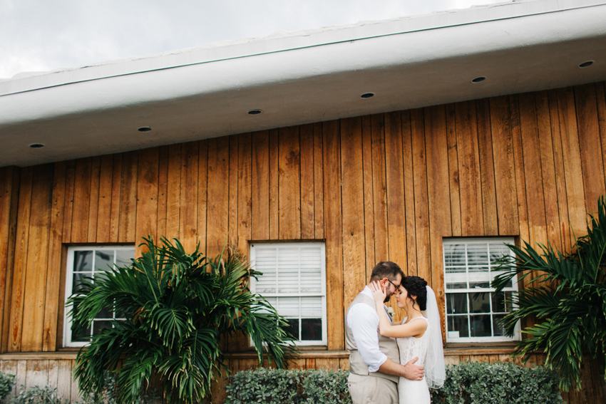 Sweet newlywed photos in front of the Postcard Inn during a romantic spring wedding