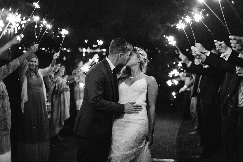 Sweet and romantic sparkler exit at a New England wedding in Newport by destination wedding photographer Renee Nicole Photography
