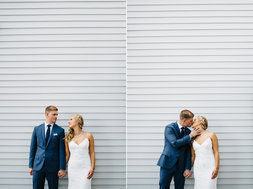 Modern wedding photography in front of a while wall in downtown Newport before the ceremony along the coastal cliff walk at The Chanler