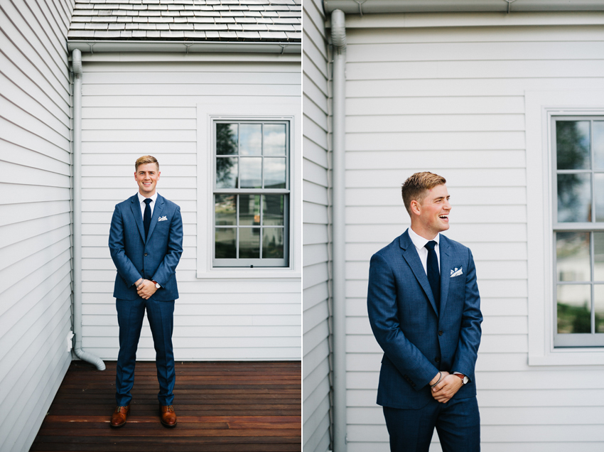 Groom wearing a navy blue Jcrew suit on his wedding day in Newport, Rhode Island at the Chanler