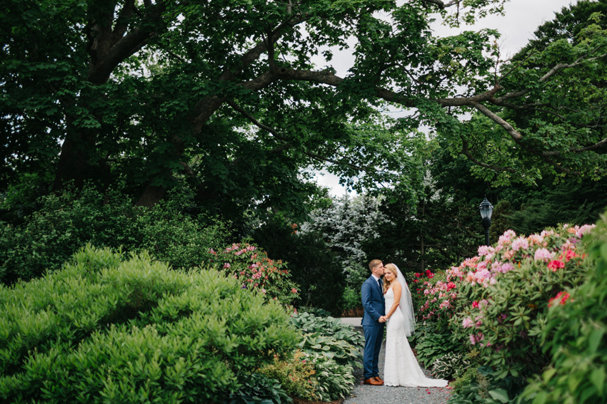 Beautiful garden wedding photos with the bride and groom with soft natural light at The Chanler in Newport Rhode Island
